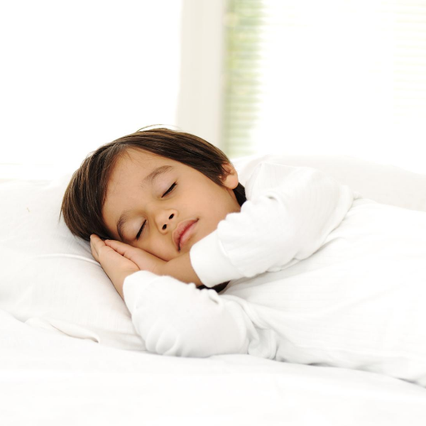 Image of child sleeping with head on pillow.
