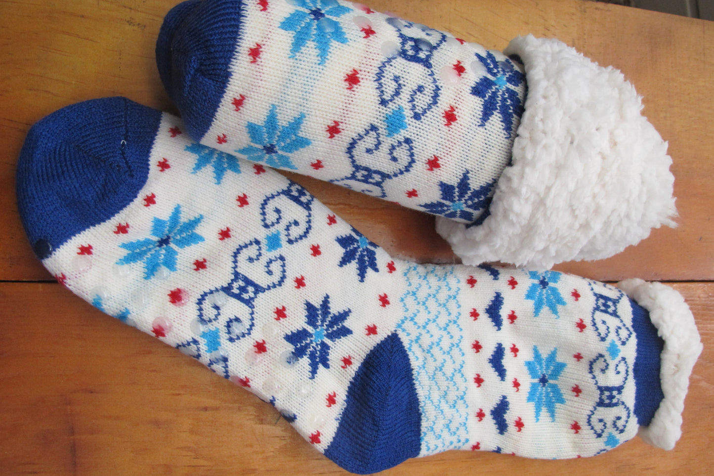 Sherpa-Lined Cabin Socks .  Blue and red color.  Snowflake/faireisle design