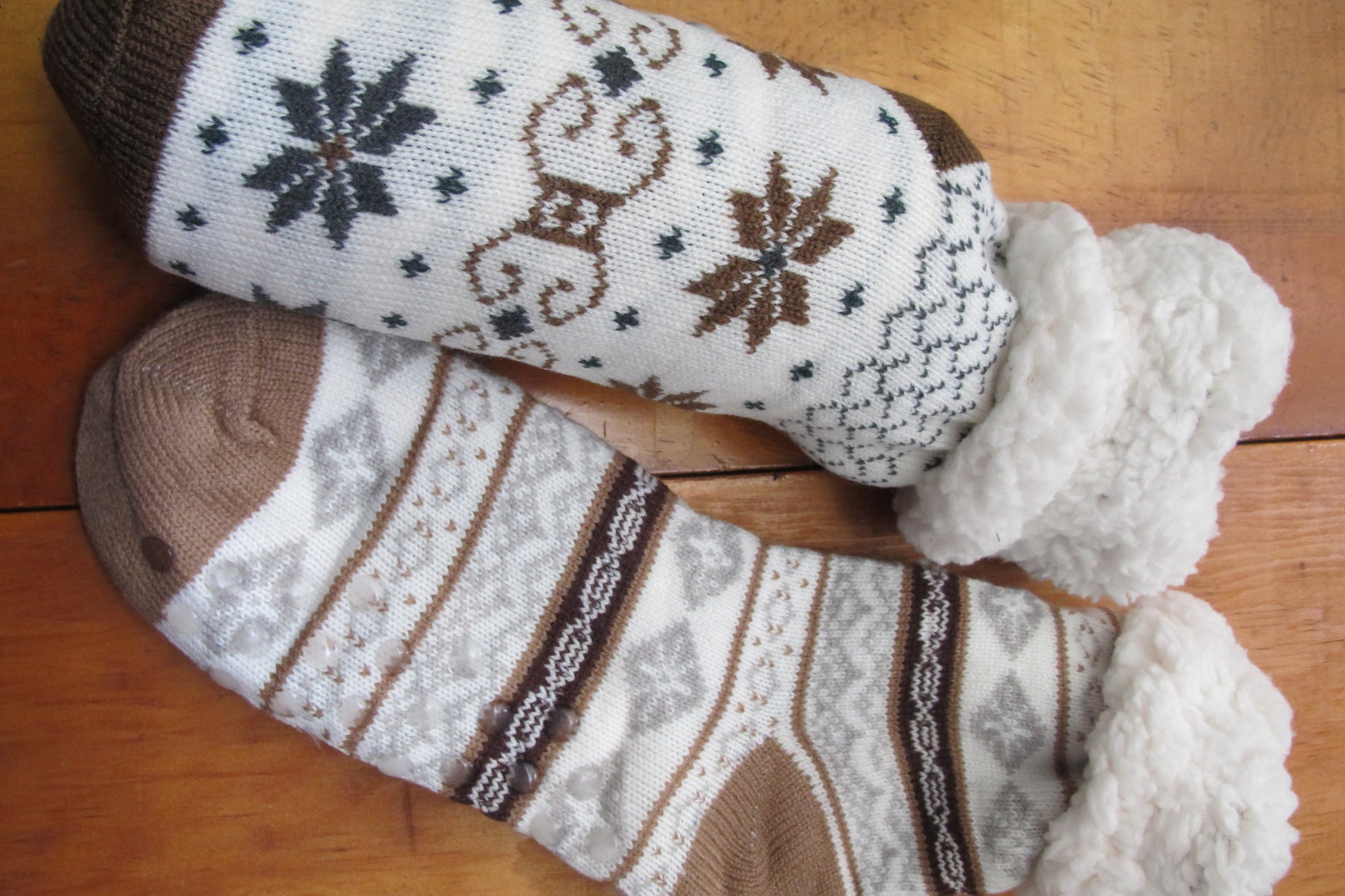 Sherpa-Lined Cabin Socks. Image shows grey and brown color.  Snowflake/faireisle design