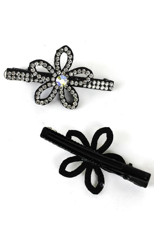 Image of 2 flower style rhinestone clips, showing the backside which is black