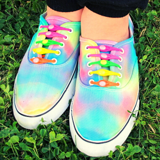 No-Touch Laces! - Tumble into Love.  Image showing rainbow sneakers with the rainbow no-touch laces.  Each lace is a different color.  Image shows orange, yellow, green, purple and pink.